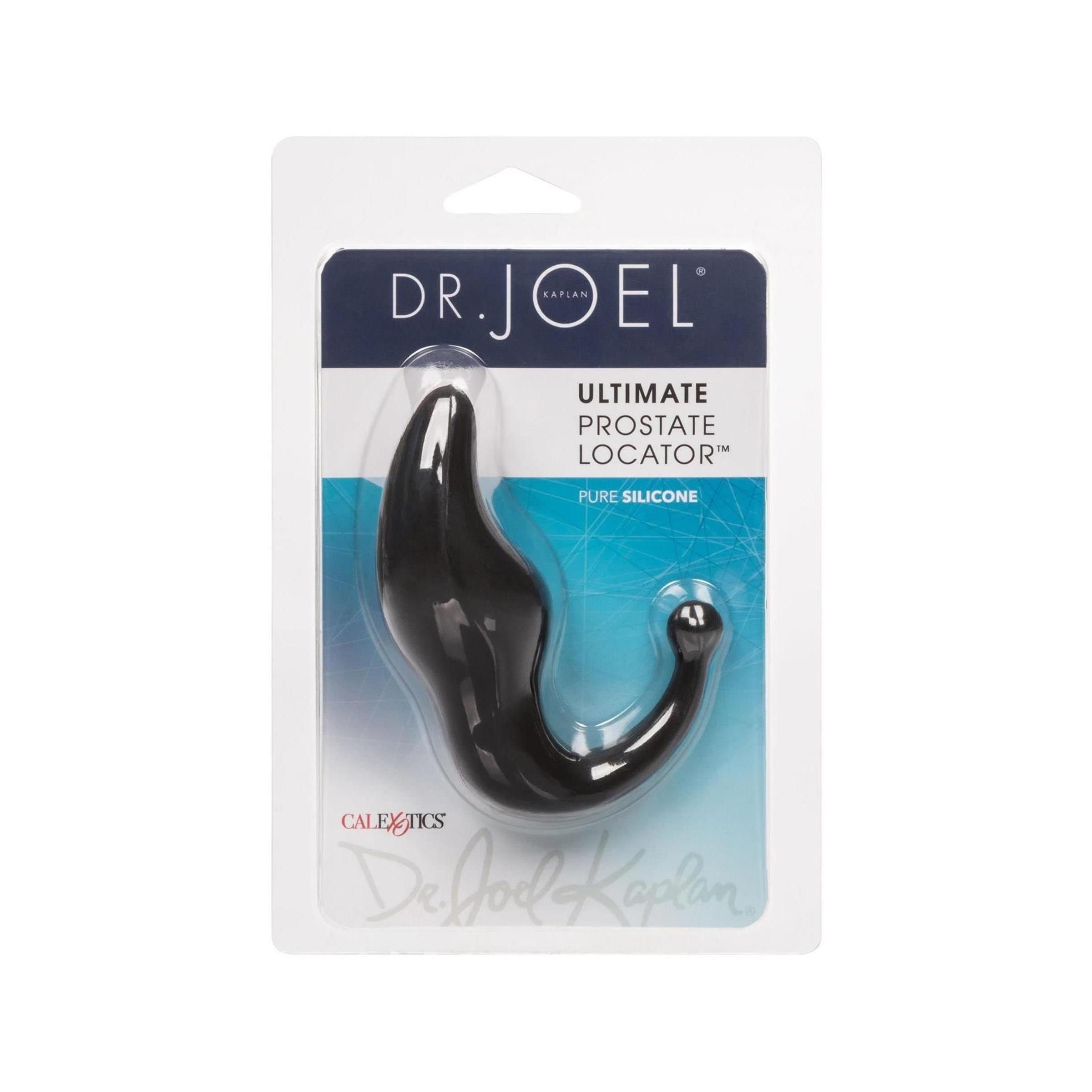 Schwarzes, anatomisch geformtes Wellness-Produkt aus Silikon, in Blisterverpackung. Mit Produkt- und Markenbezeichnung.