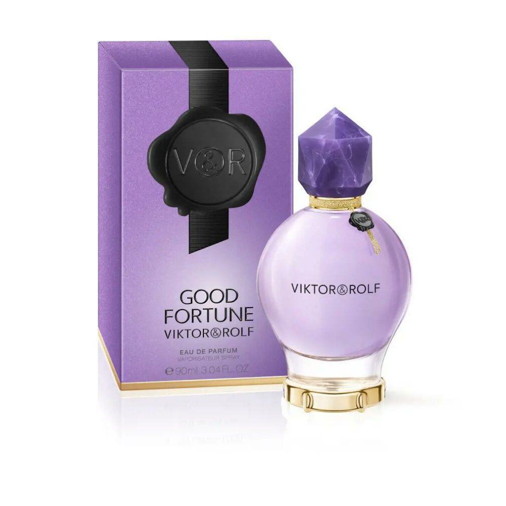 Flakon und Schachtel von Viktor & Rolf Good Fortune. Flakon rund, lila, mit Kristallverschluss. Schachtel lila mit schwarzem Siegel.