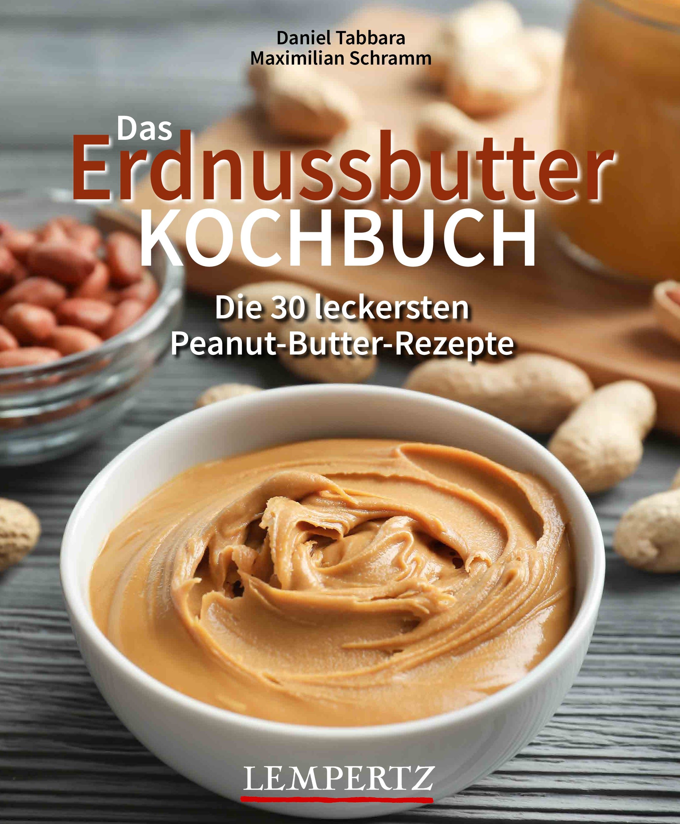 Kochbuch mit Titel "Das Erdnussbutter Kochbuch". Autoren: Daniel Tabbara, Maximilian Schramm. Auf dem Cover Erdnussbutter und Erdnüsse.