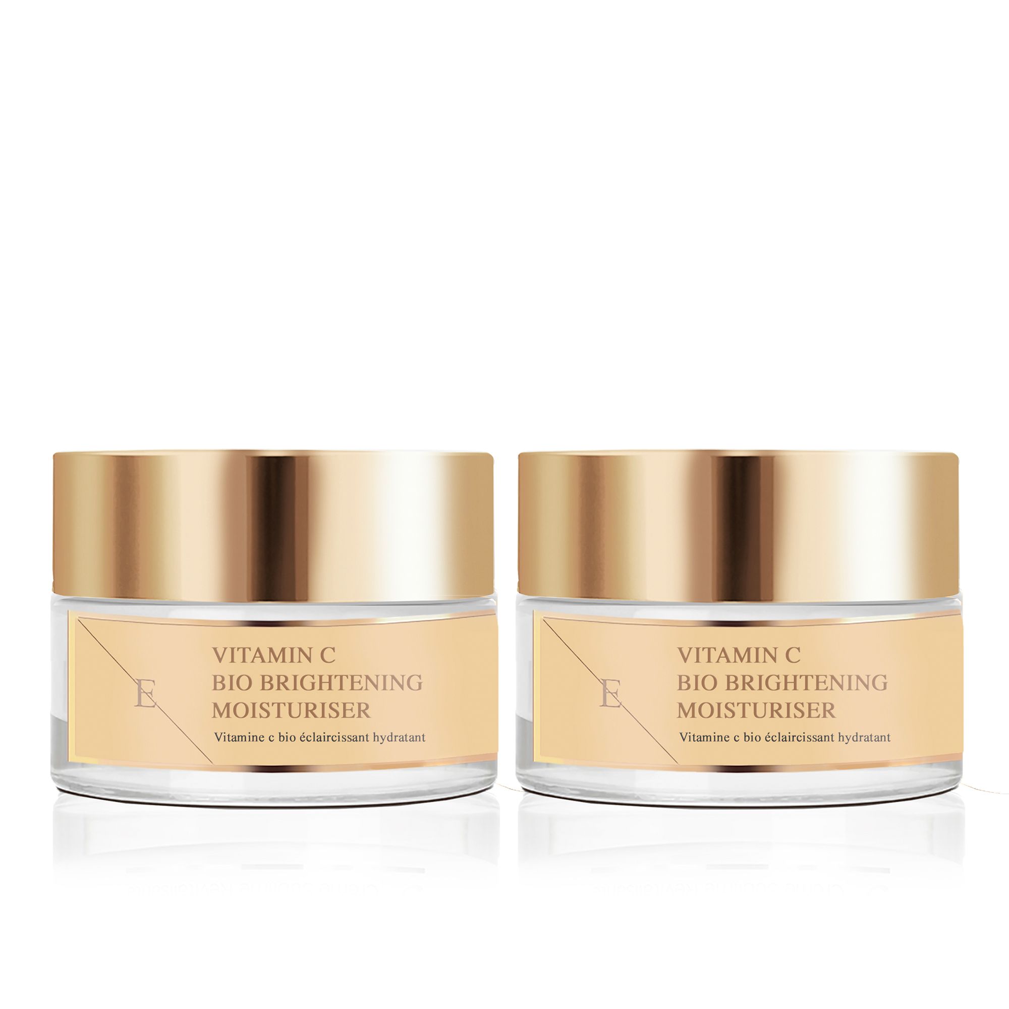Twee crèmepotten met gouden deksels. Opschrift: Vitamin C Bio Brightening Moisturiser. Sticker met logo.