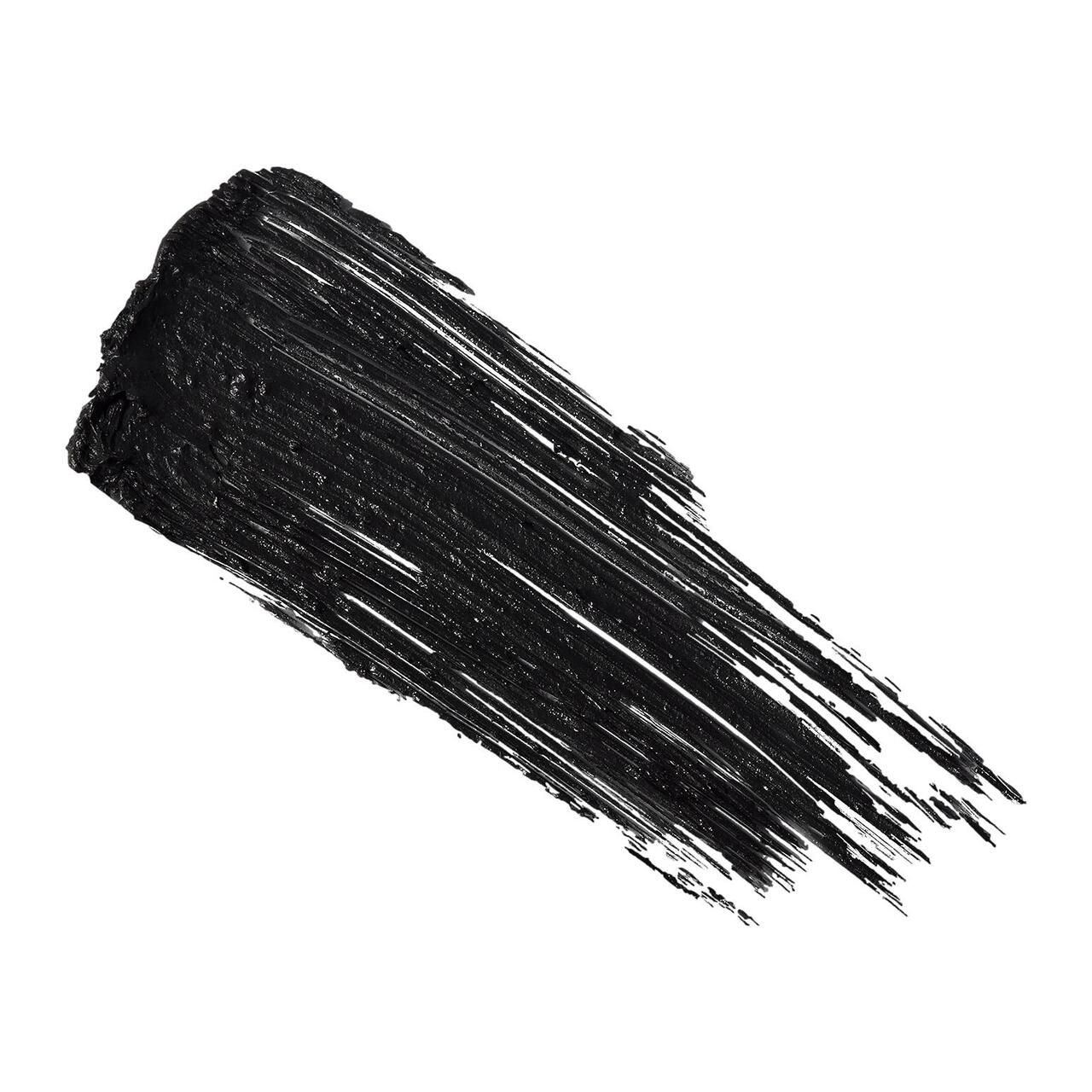 Schwarzer Mascara-Strich auf weißem Hintergrund. Textur sichtbar.
