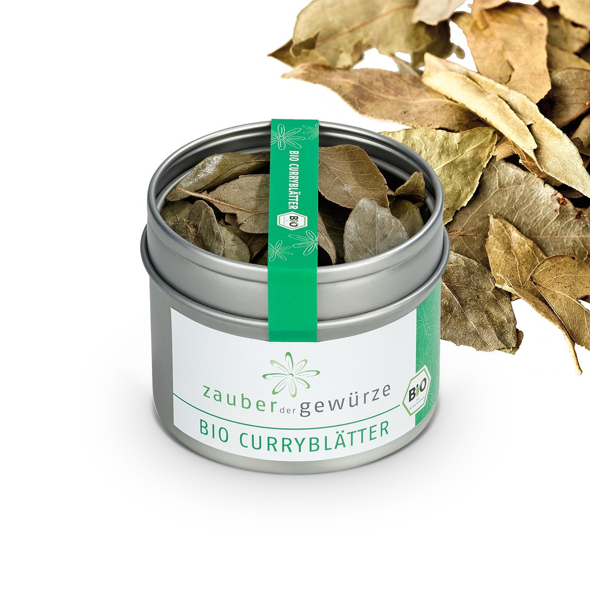 Geöffnete Dose Bio Curryblätter. Grün-weißes Etikett mit Produktname und Bio-Siegel. Blätter liegen daneben.