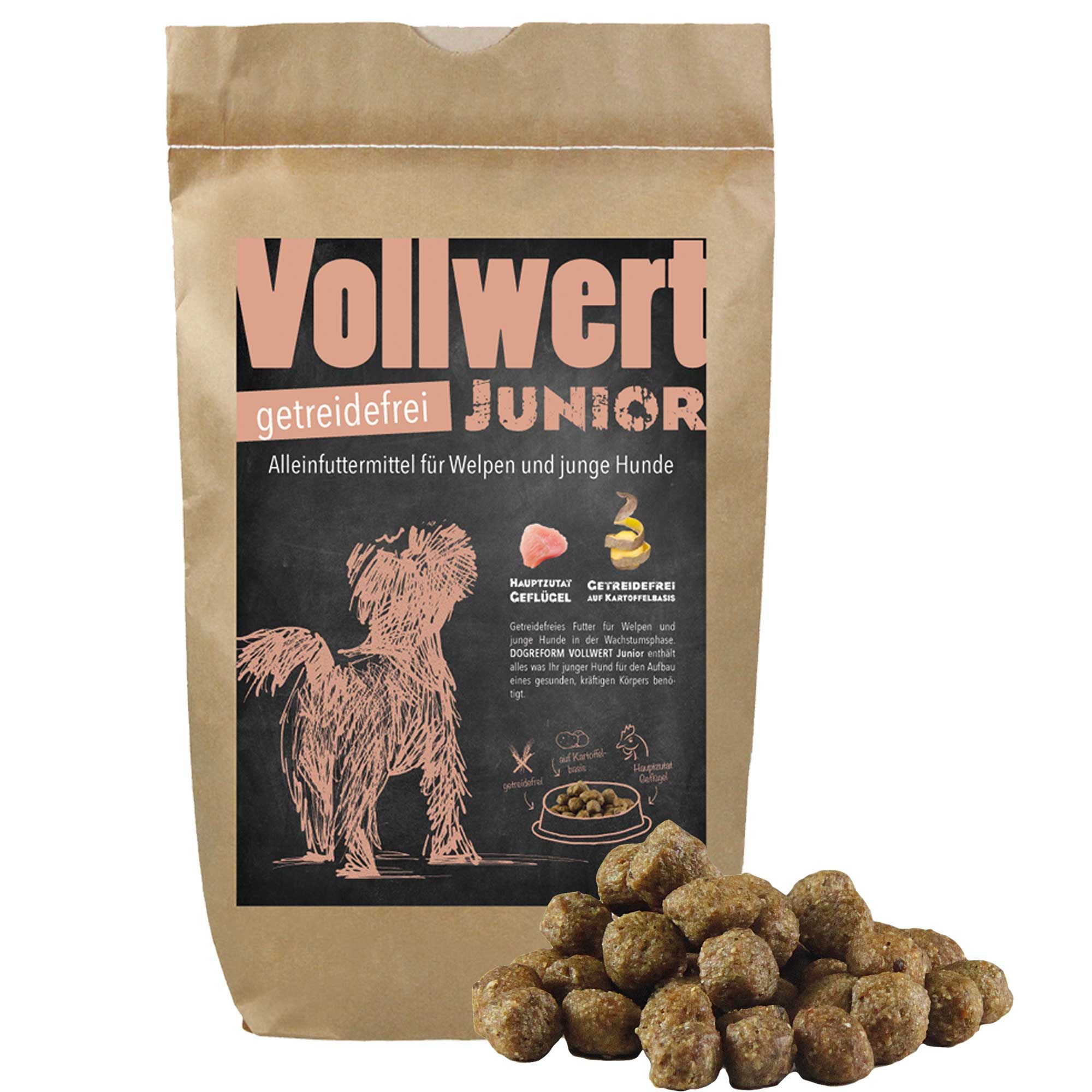 Braune Papiertüte mit Aufdruck. Schriftzug "Vollwert Junior". Illustration eines Hundes. Haufen Hundefutterbrocken daneben.