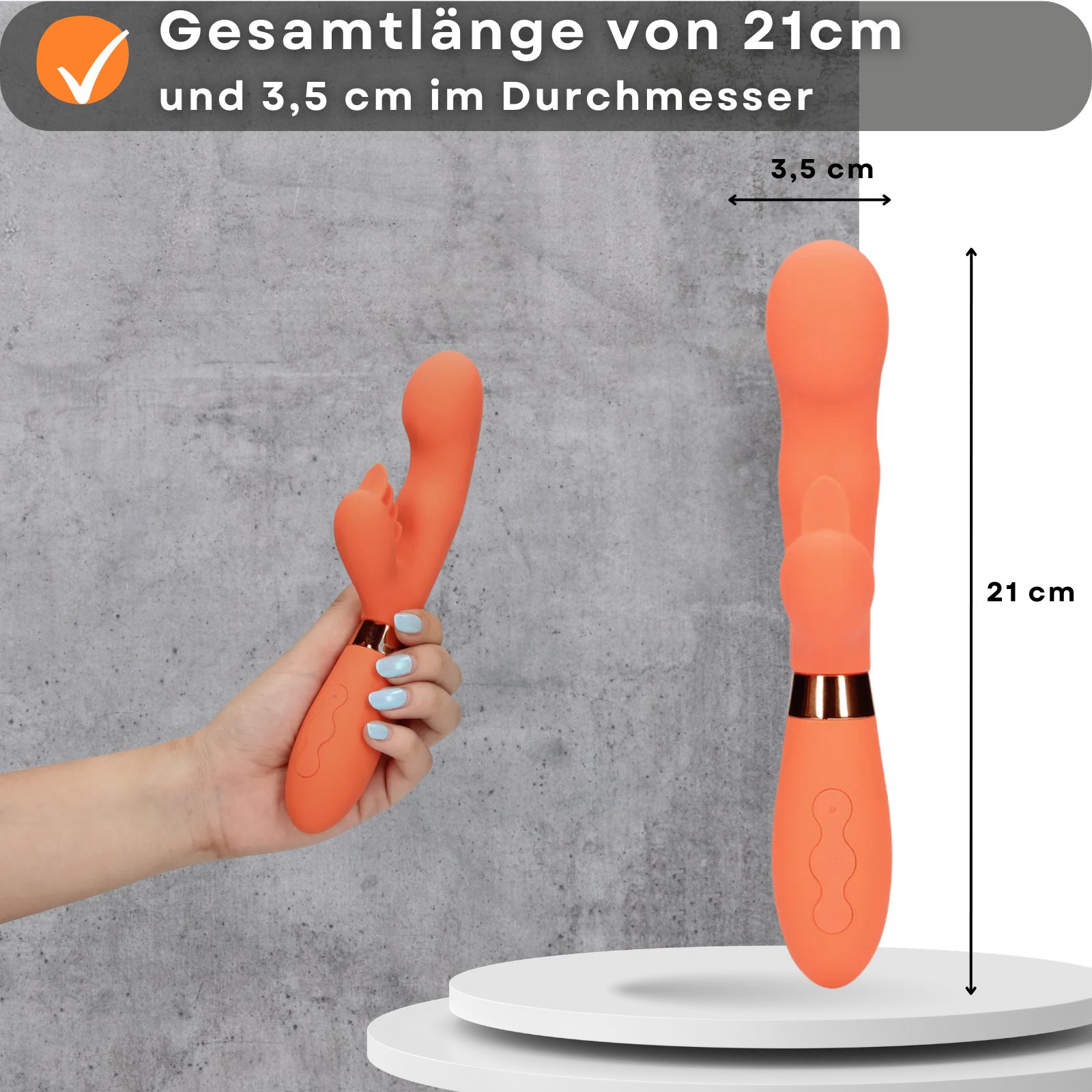 Orangefarbener Vibrator, 21 cm lang, 3,5 cm Durchmesser. Gehalten von einer Hand.