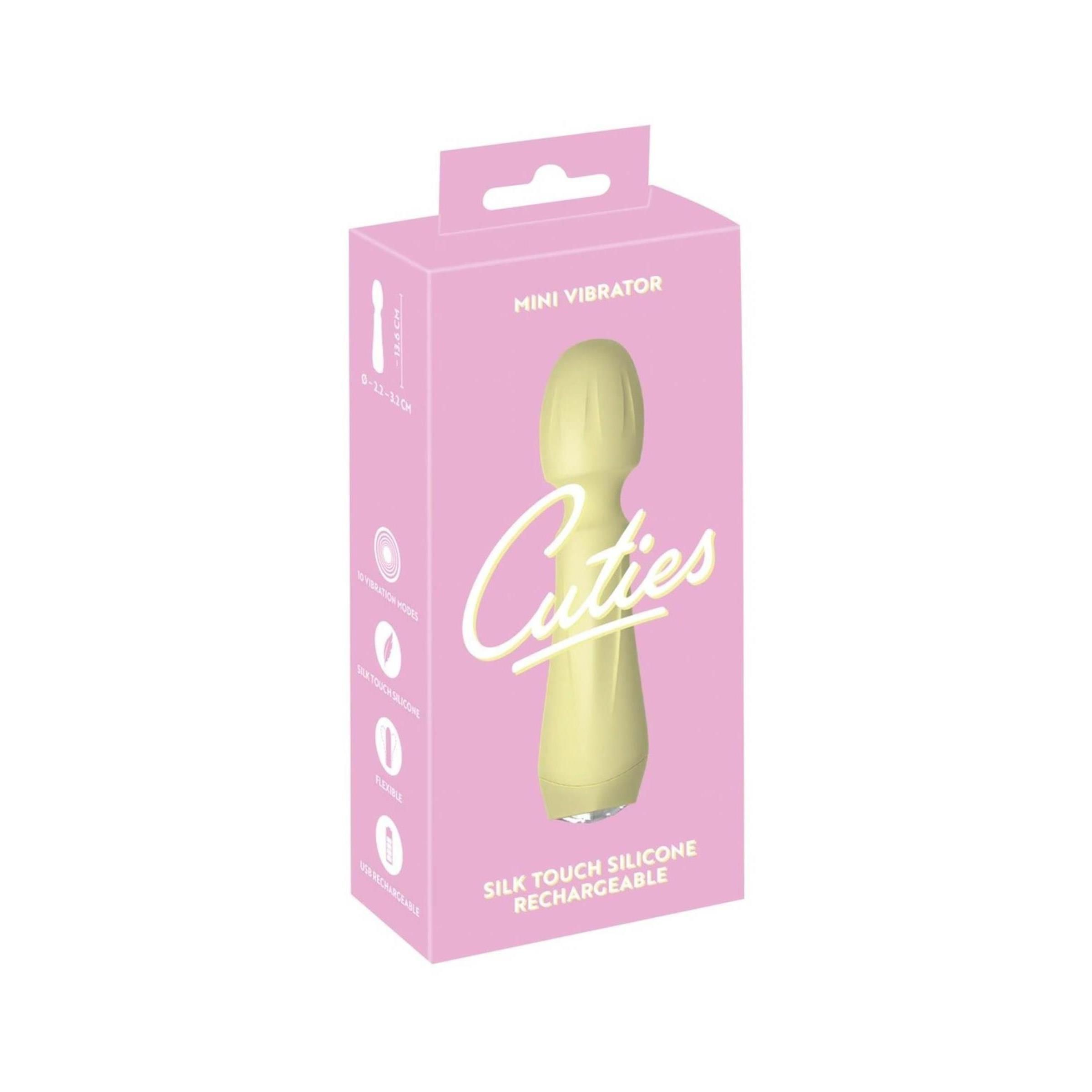 Rosa Verpackung mit gelbem Mini-Vibrator. Aufschrift: Cuties, Mini Vibrator, Silk Touch Silicone, Rechargeable.