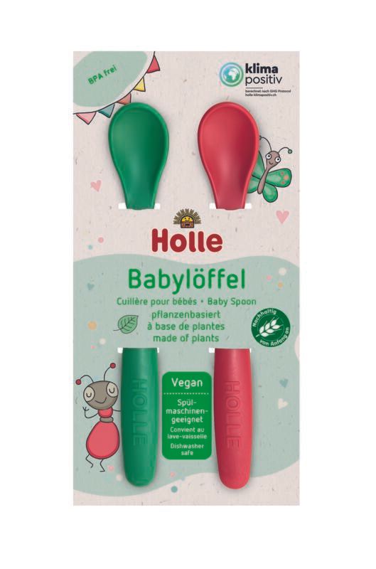 Holle Babylöffel-Verpackung. Zwei grüne und rote Löffel. Text: Baby Spoon, pflanzenbasiert, vegan, spülmaschinengeeignet.