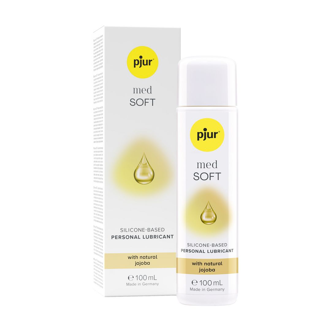 Flasche und Verpackung. Aufschrift: pjur med SOFT, silikonbasiertes Gleitmittel. Mit Jojobaöl. Gelbe Tropfen-Illustration.