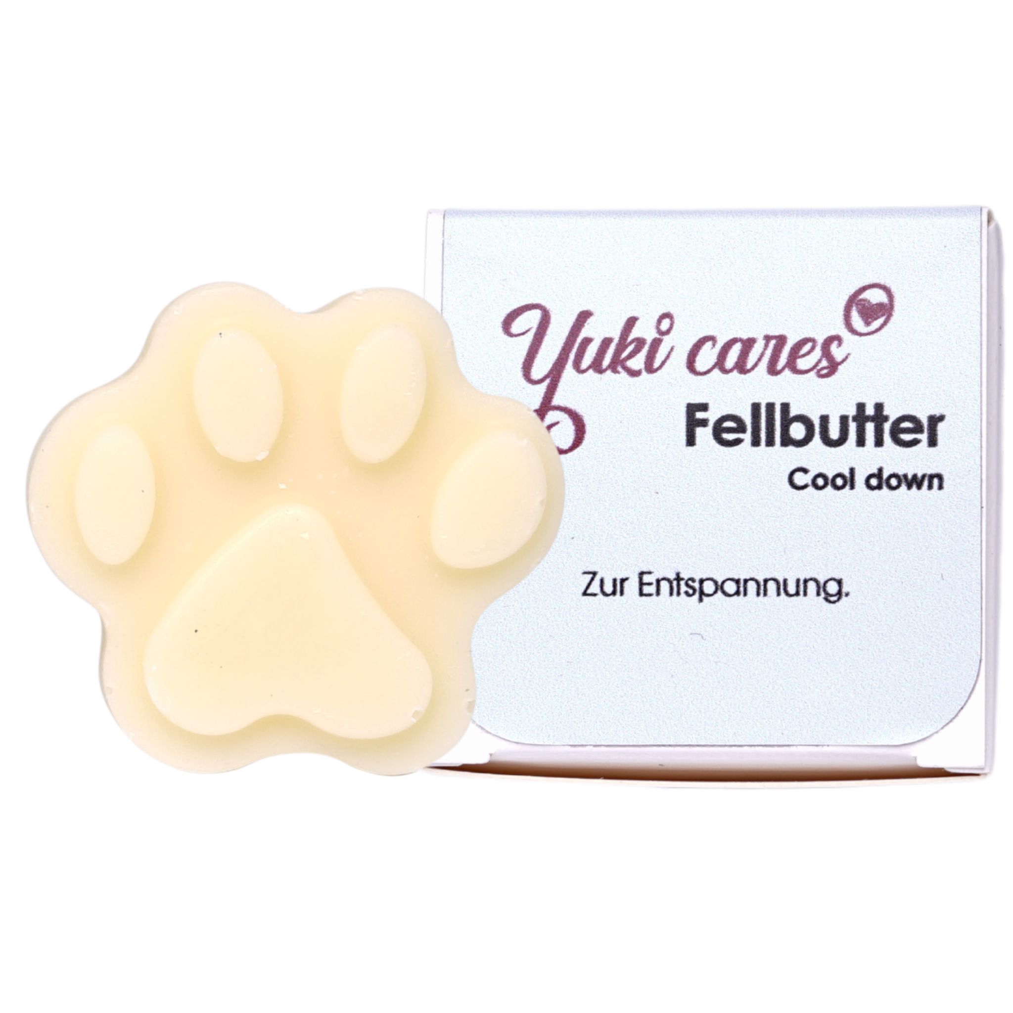 Pfotenform Fellbutter, cremefarben. Neben einer Verpackung mit Yuki cares, Fellbutter, Cool down und "Zur Entspannung".