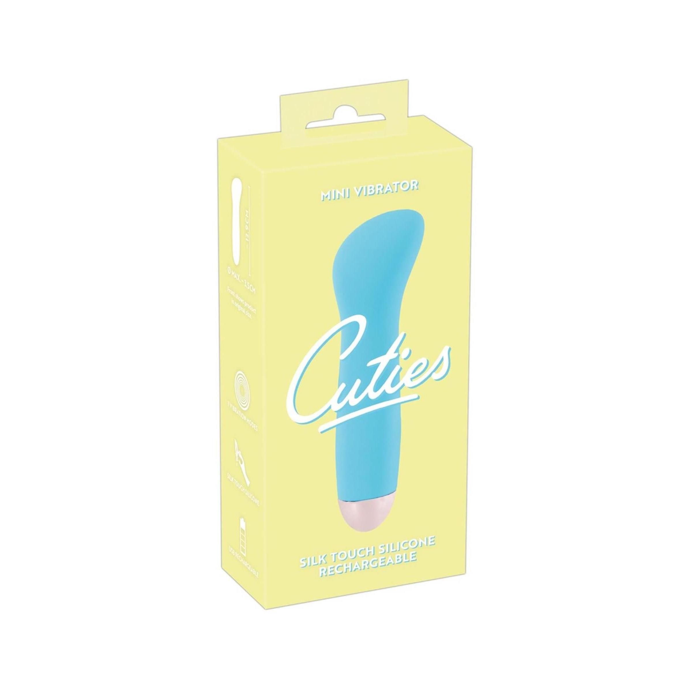 Verpackung mit türkisfarbenem Vibrator. Rosa Spitze. Aufschrift: Cuties.