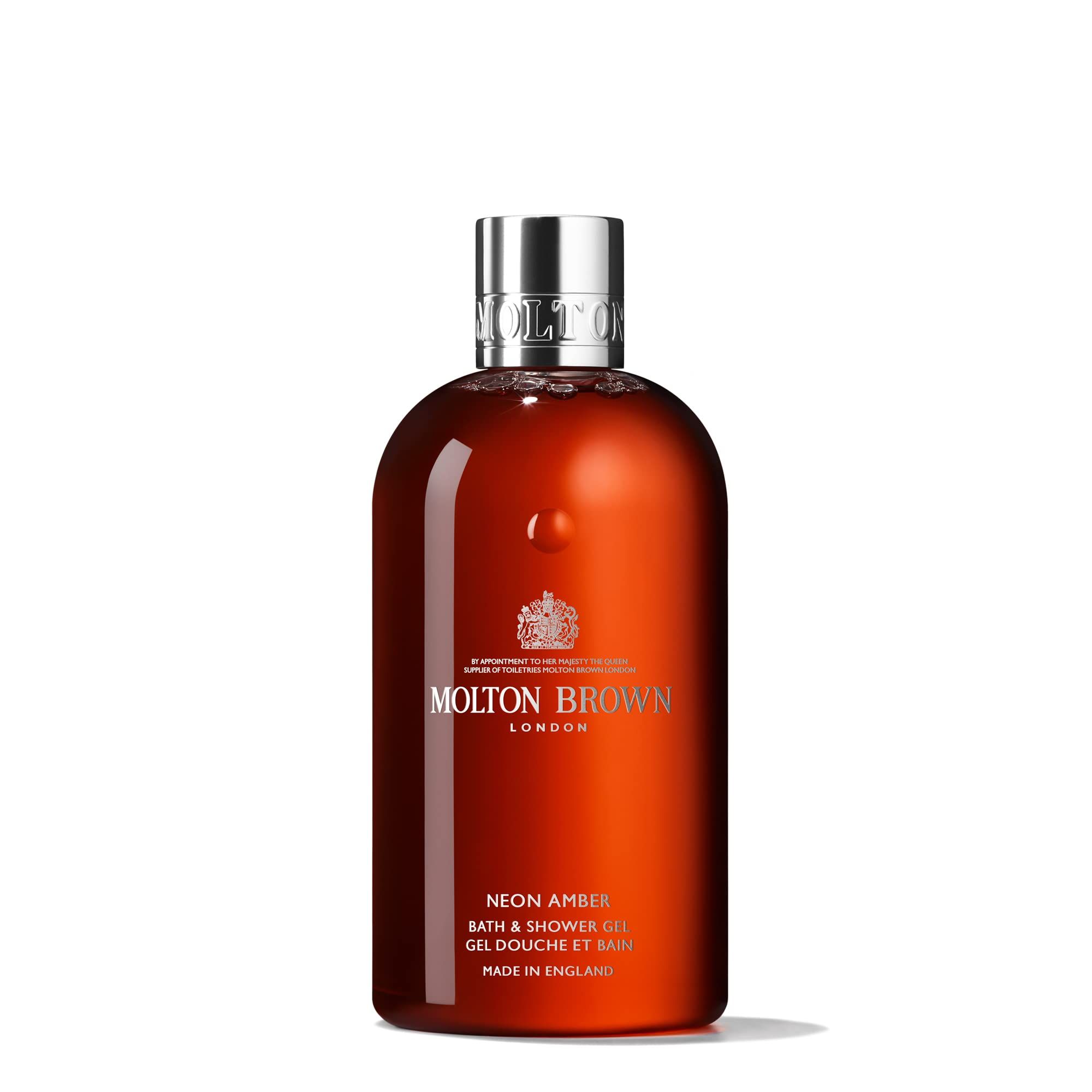Braune Flasche mit silbernem Deckel. Text: Neon Amber Bath & Shower Gel. Made in England. Logo: Molton Brown London.