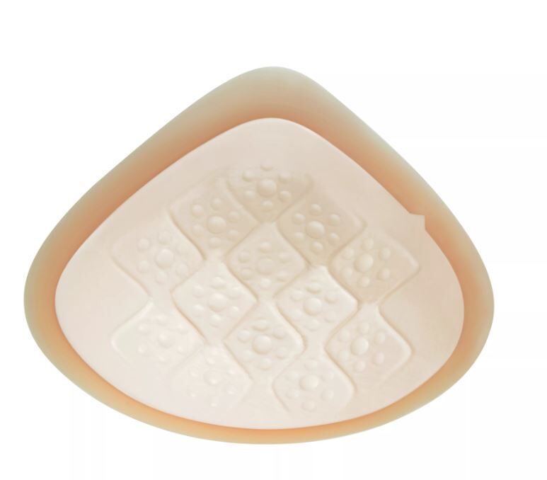 Dreieckige Ausgleichsepithese. Beige, mit Luftkammern. Oberfläche mit erhabenen Elementen.