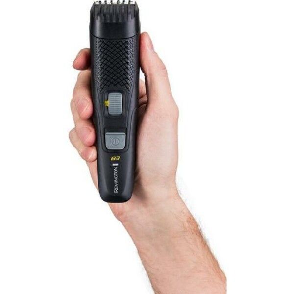 Schwarzer Bartschneider in einer Hand gehalten. Sichtbar: Remington-Logo und E3-Anzeige.