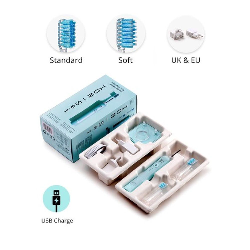 Zahnbürste in Verpackung mit Zubehör: Bürstenköpfe, Ladestation, Stecker.
