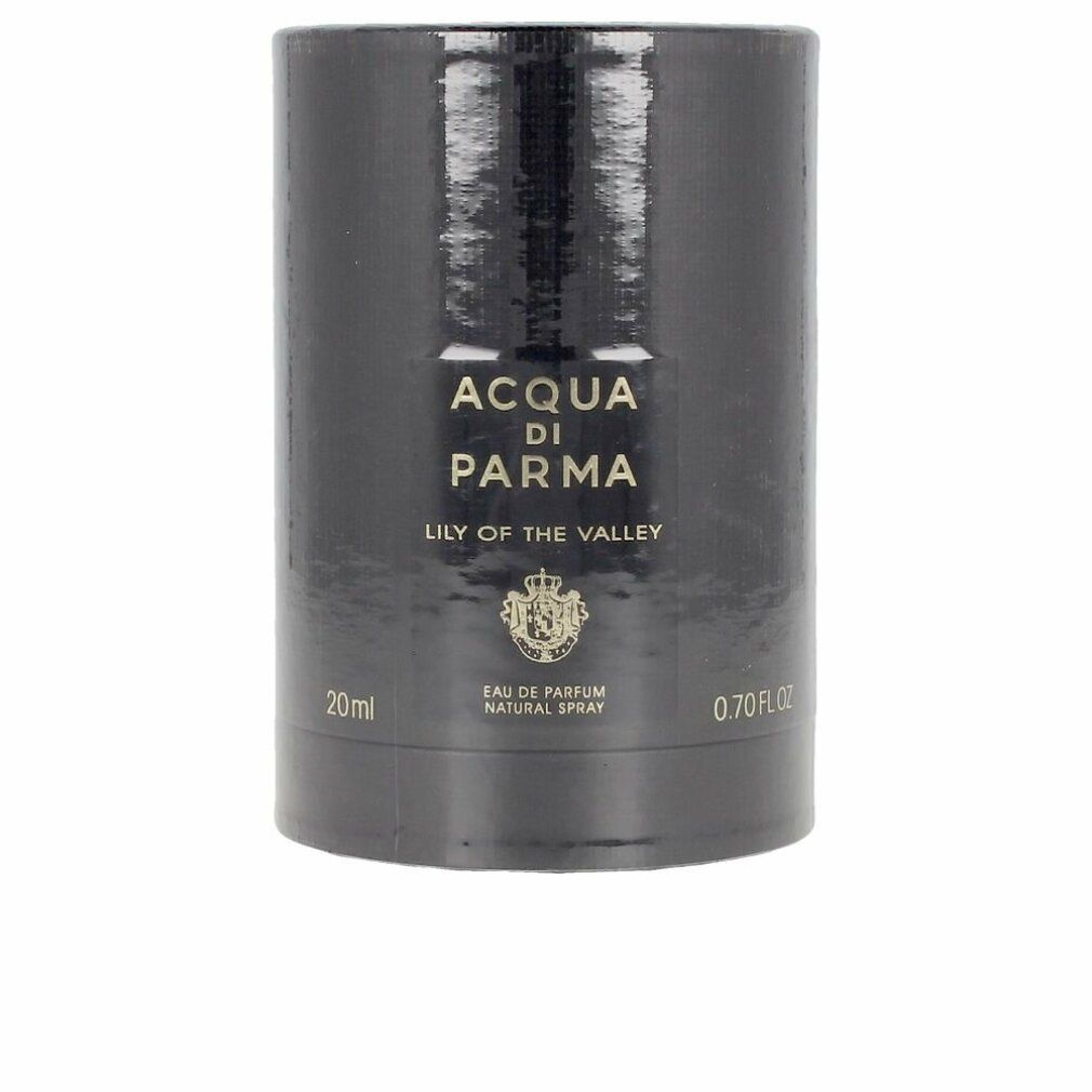 Zylindrische Verpackung. Aufschrift: Acqua Di Parma, Lily Of The Valley. Schwarzes Etikett mit goldenem Wappen. Volumenangabe.