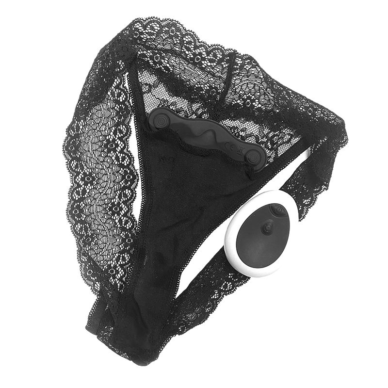 Schwarzer String-Tanga mit Spitze, mit einem schwarzen Vibrator und einer weißen Fernbedienung.