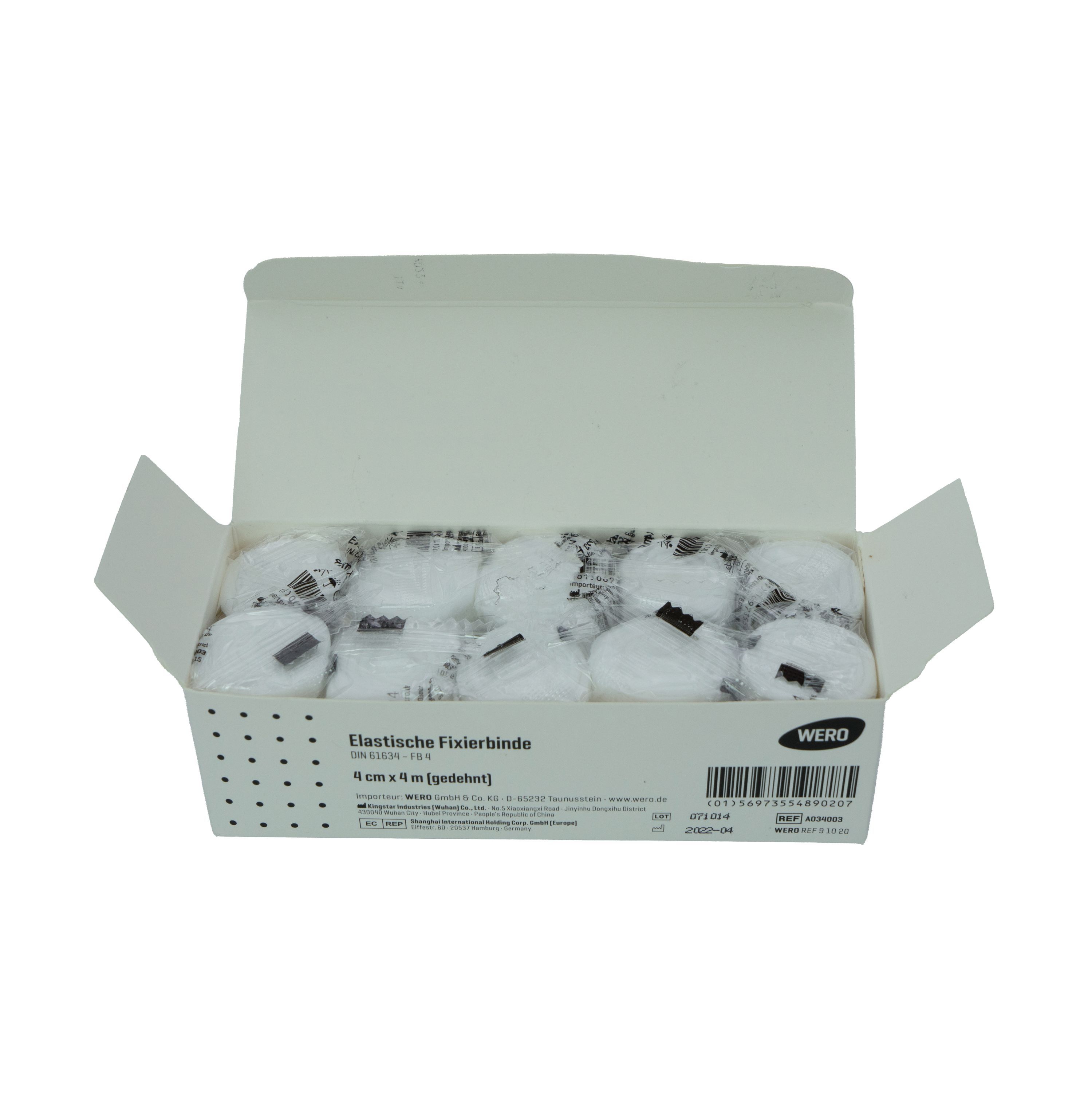 Geöffnete WERO Fixierbinden-Packung. Mehrere weiße, gerollte Binden im Karton. Produktbezeichnung sichtbar.