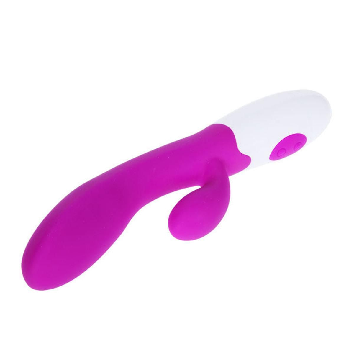 Lila Vibrator mit weißem Sockel. Mit Knöpfen. Aus Silikon.