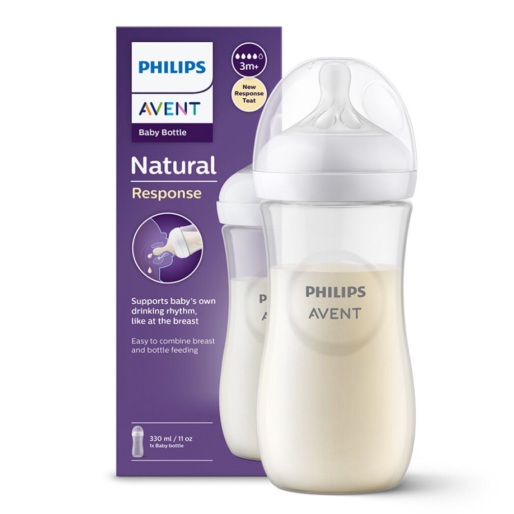 Babyflasche mit Milch und Verpackung. Flasche mit weißem Deckel und Sauger. Aufschrift: Philips Avent, Natural Response. Verpackung.