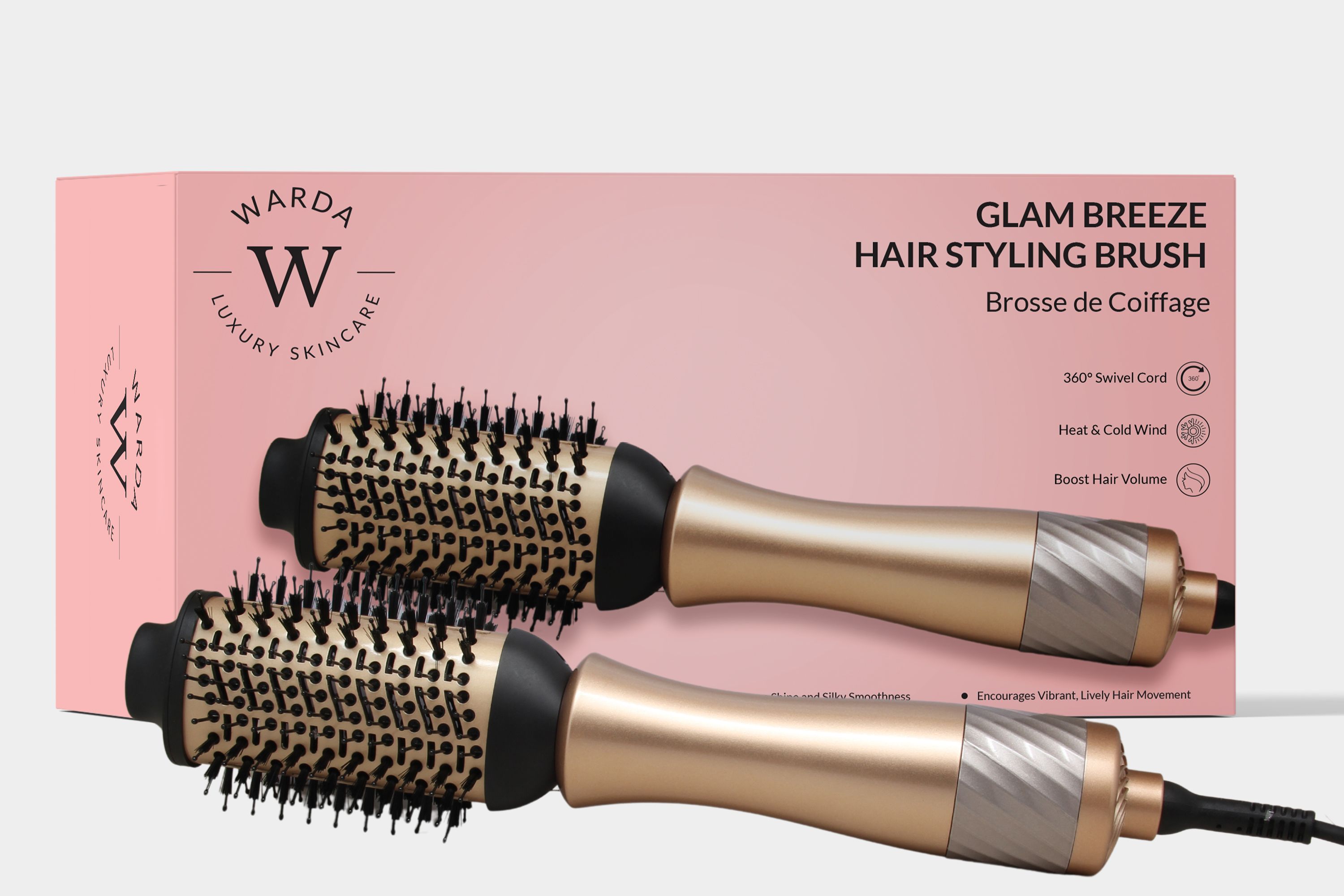 Haarstylingborstel met roze verpakking. Gouden handvat, zwarte borstelharen. Merk: Warda Skincare. Tekst: Glam Breeze Hair Styling Brush.