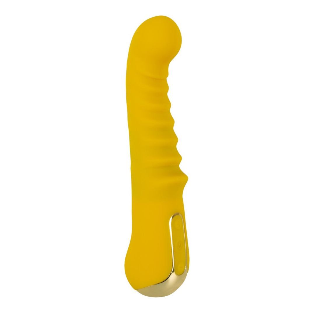 Gelber Vibrator mit geriffelter Oberfläche und goldfarbenem Ende. Vertikale Ansicht.
