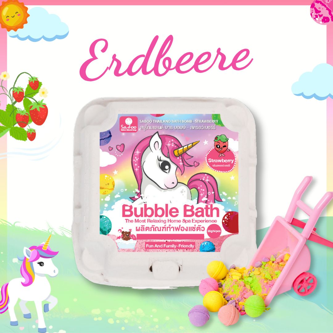 Verpackung mit Erdbeer-Badbomben. Einhorn-Motiv. Aufschrift: Bubble Bath. Kleine Schubkarre mit bunten Kugeln.