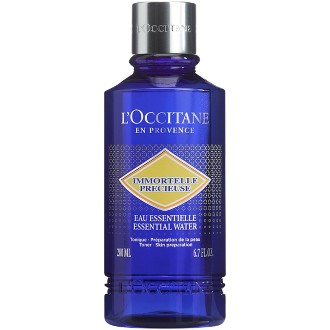 Blau-transparente Flasche mit silbernem Deckel. Aufschrift: L'Occitane, Immortelle Précieuse, 200 ml, 6.7 FL.OZ.