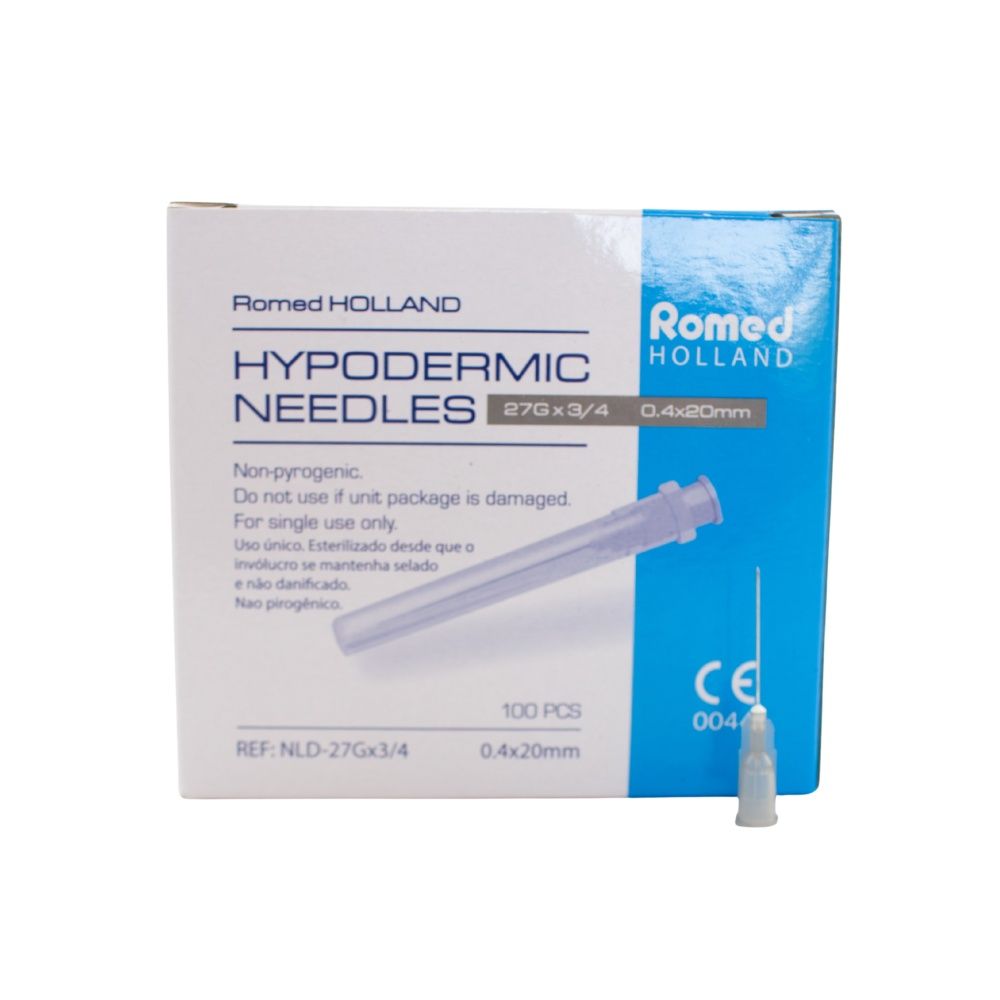 Packung mit Injektionskanülen. Aufschrift: Romed Holland, Hypodermic Needles 27G x 3/4, 0,4 x 20mm. Einzelne Kanüle daneben.