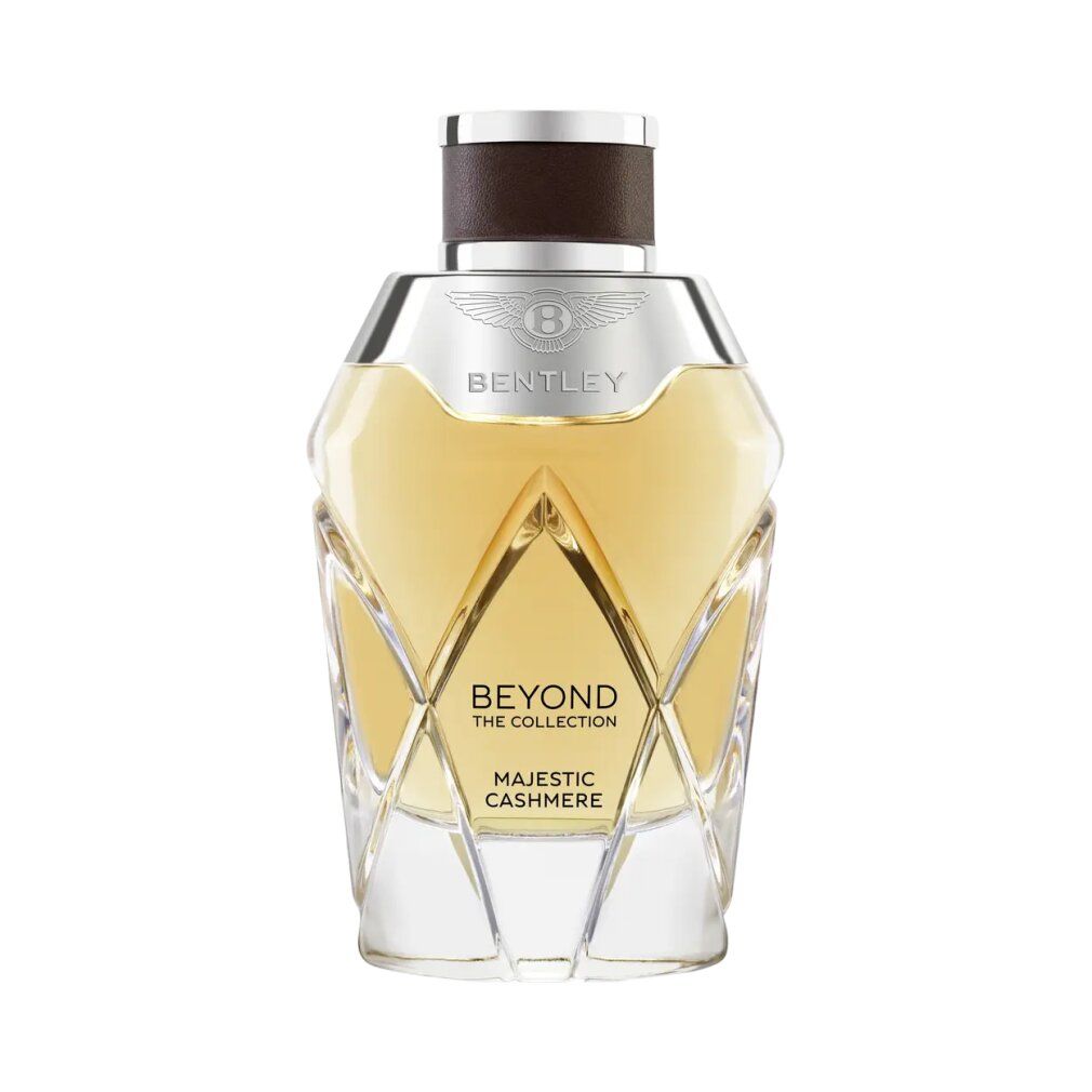 Bentley Majestic Cashmere Eau de Parfum Spray. Geformter Flakon mit silbernem Deckel. Klarer Glasflakon mit goldener Flüssigkeit.
