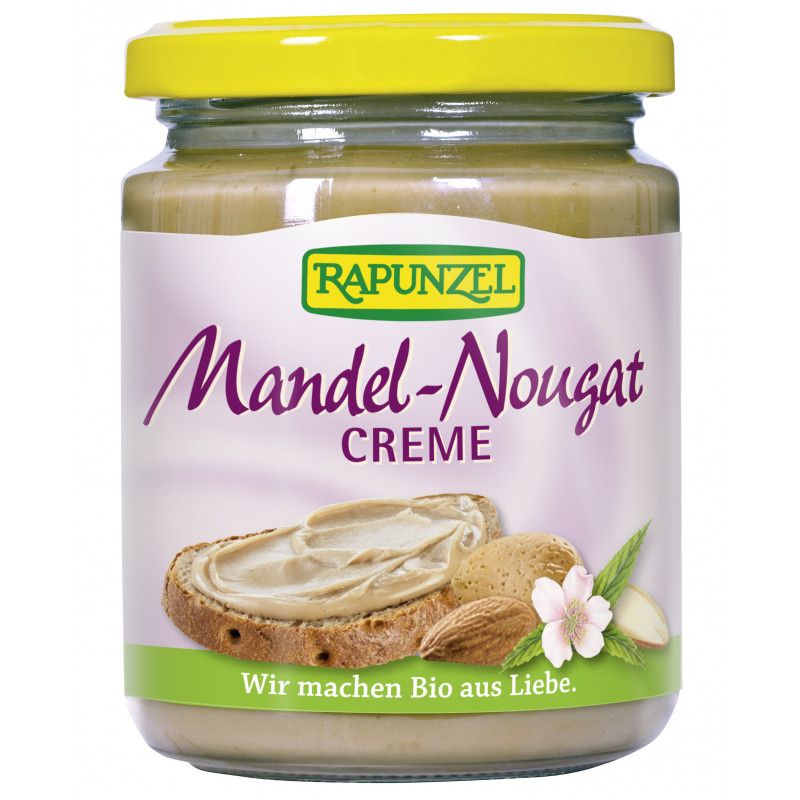 Glas mit Mandel-Nougat-Creme. Gelber Deckel, lila Etikett mit Produktnamen und Abbildung von Brot, Mandeln und Blüte.