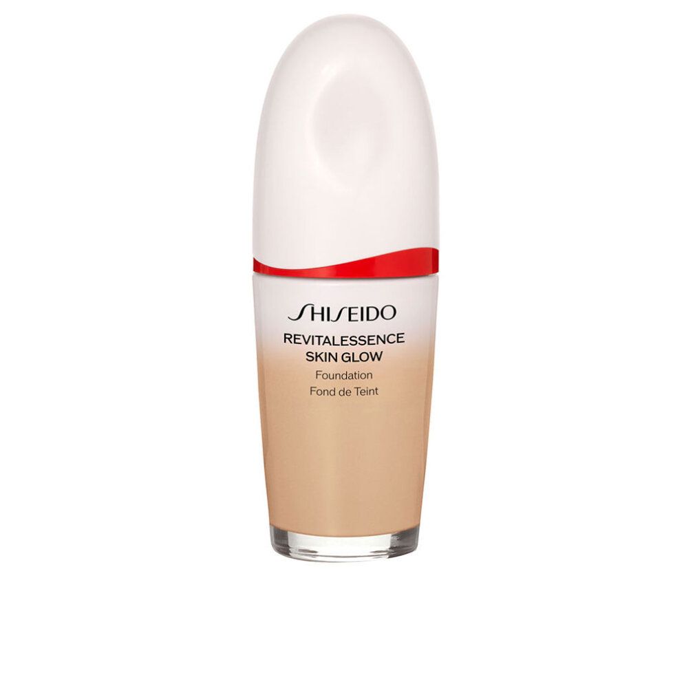Kosmetikflasche mit weißem Deckel, rotem Band und Farbverlauf. Aufschrift: Shiseido Revitalessence Skin Glow Foundation.