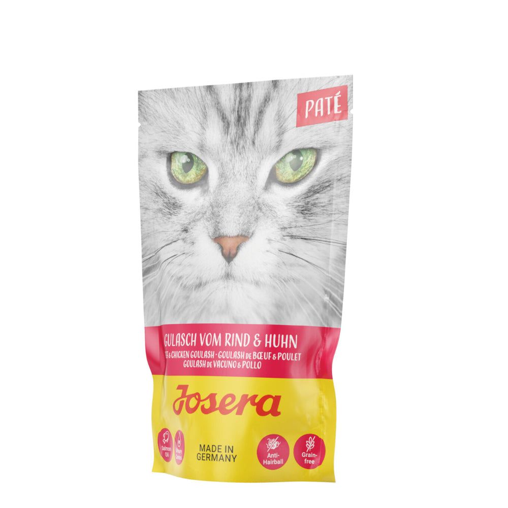 Josera Paté Gulasch vom Rind & Huhn. Beutel mit Katzenkopf und Produktinformationen. Rosa-gelbe Farbgebung.