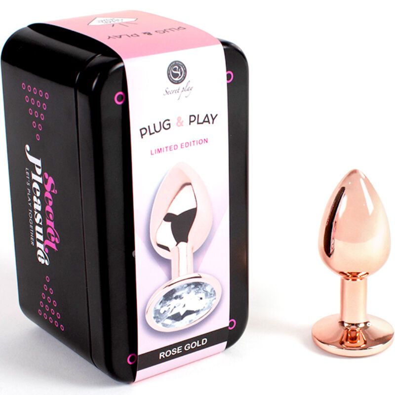 Metall-Butt-Plug Roségold, kleine Größe, neben schwarzer Dose mit Aufdruck. Dose mit "Secret Play" und "Plug & Play".
