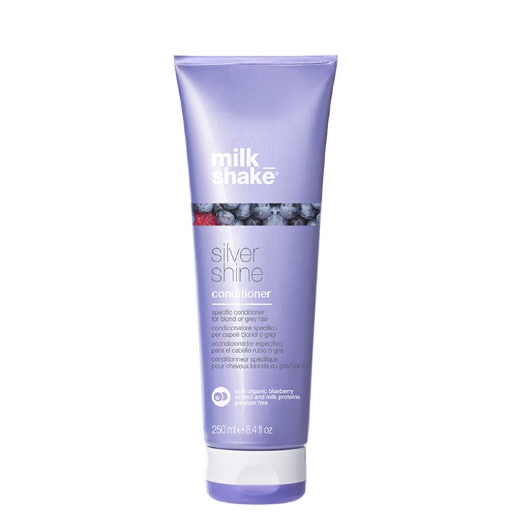 Lila Tube mit Produkt. Aufschrift: milk_shake Silver Shine Conditioner. Mit Blaubeeren-Illustration.