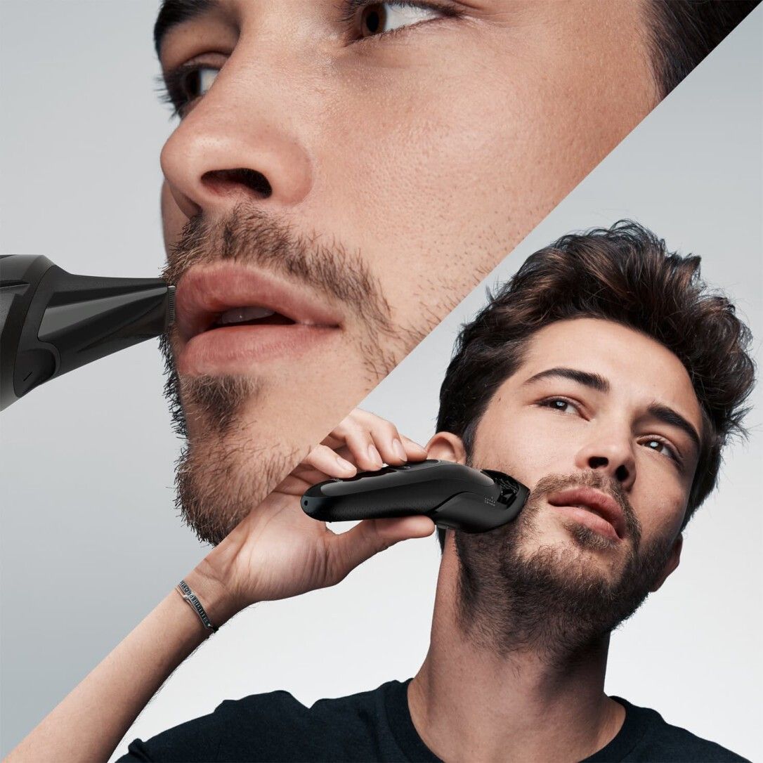 Mann rasiert Bart mit schwarzem Trimmer. Nahaufnahme. Braun-Trimmer.