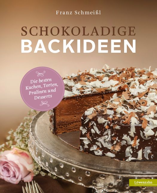 Buchcover mit Titel "Schokoladige Backideen" von Franz Schmeißl. Abgebildet ist ein Kuchen auf einer Tortenplatte. Logo "Löwenzahn".
