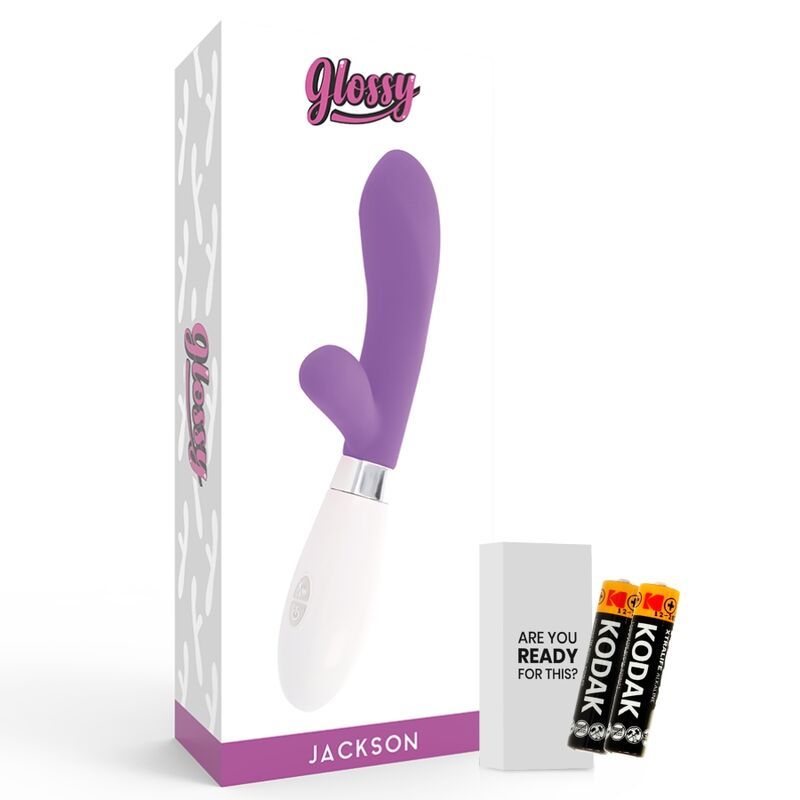 Vibrator in Verpackung. Lila-weißes Produkt, Batterien und eine Schachtel mit Text.