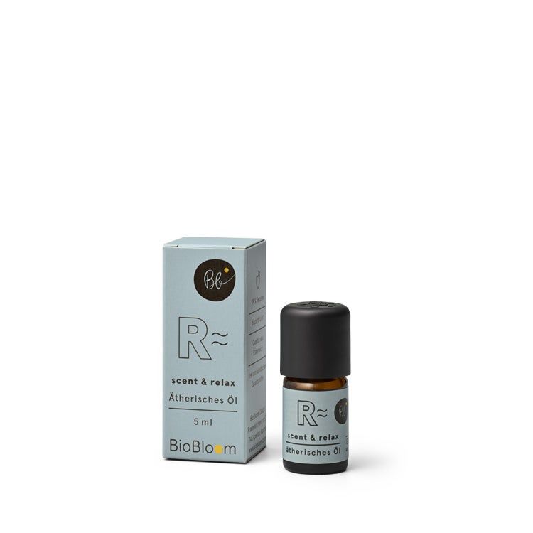 Aromatherapie-Ölflasche und Schachtel. Aufschrift: "R~ scent & relax Atherisches Öl". Flasche mit schwarzem Deckel, 5ml.
