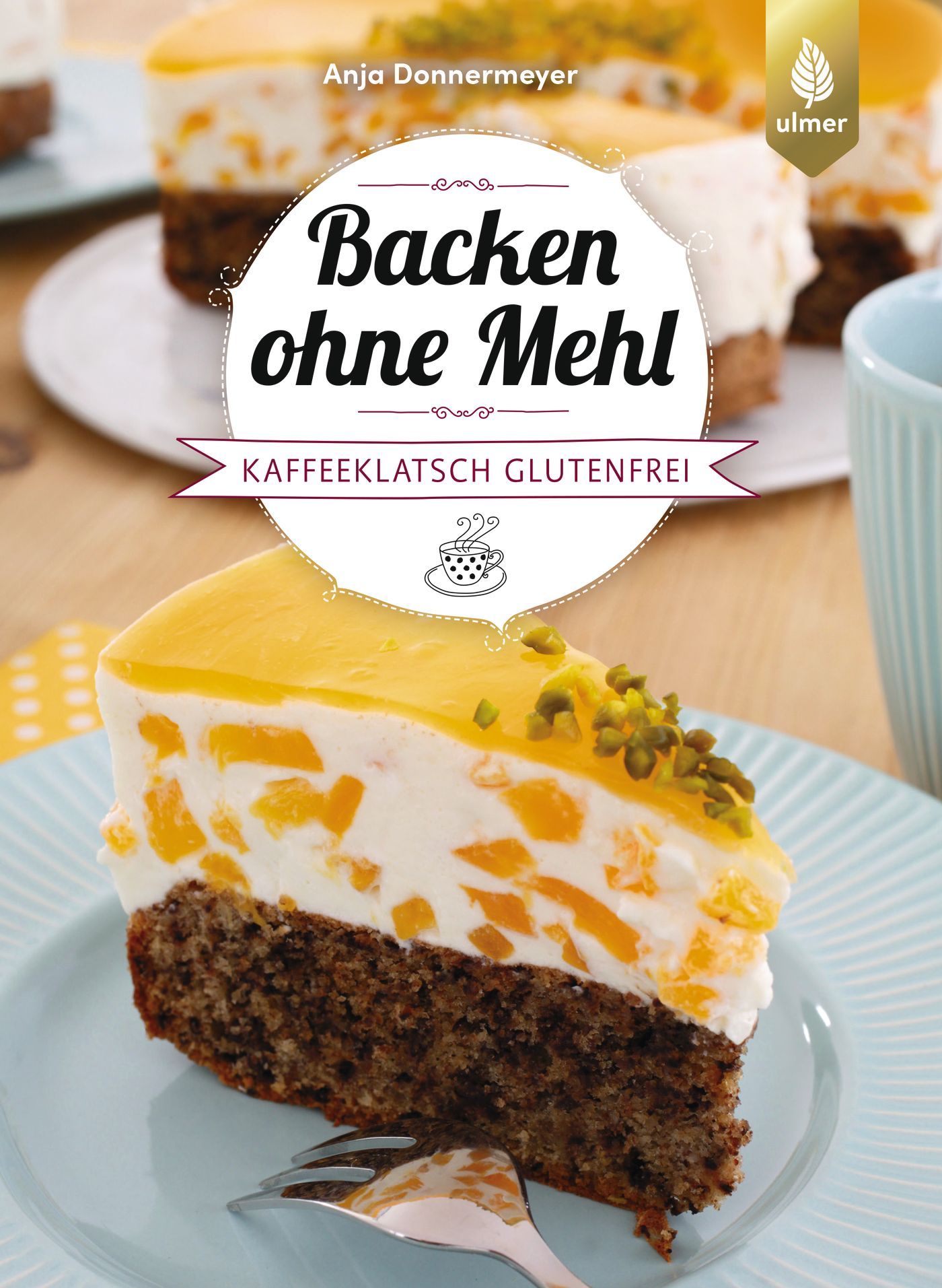 Buchcover: "Backen ohne Mehl". Kuchenstück mit Obst und Creme. Titel in schwarzer Schrift auf weißem Kreis. Glutenfrei.
