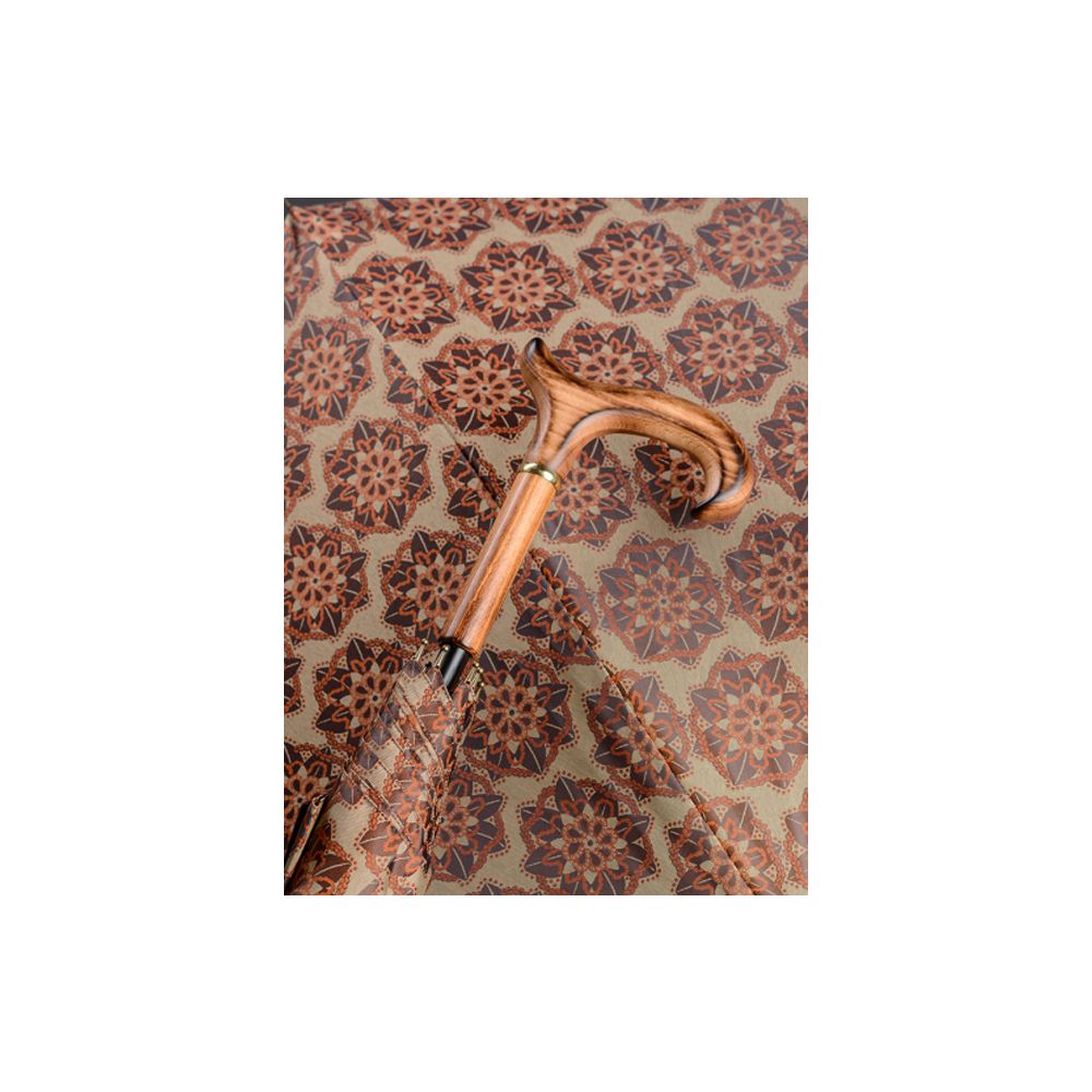 Gehstock mit Holzgriff und floralem Muster. Beige-oranger Schirm. Griff in Holzoptik, goldfarbener Ring.