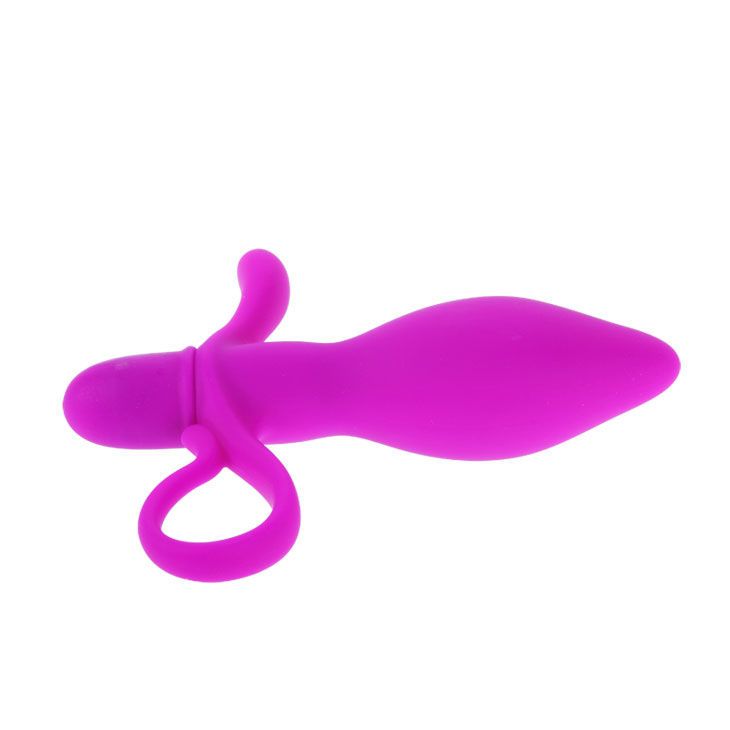 Lila Vibrator mit Ring und Flügeln. Auf weißem Hintergrund.