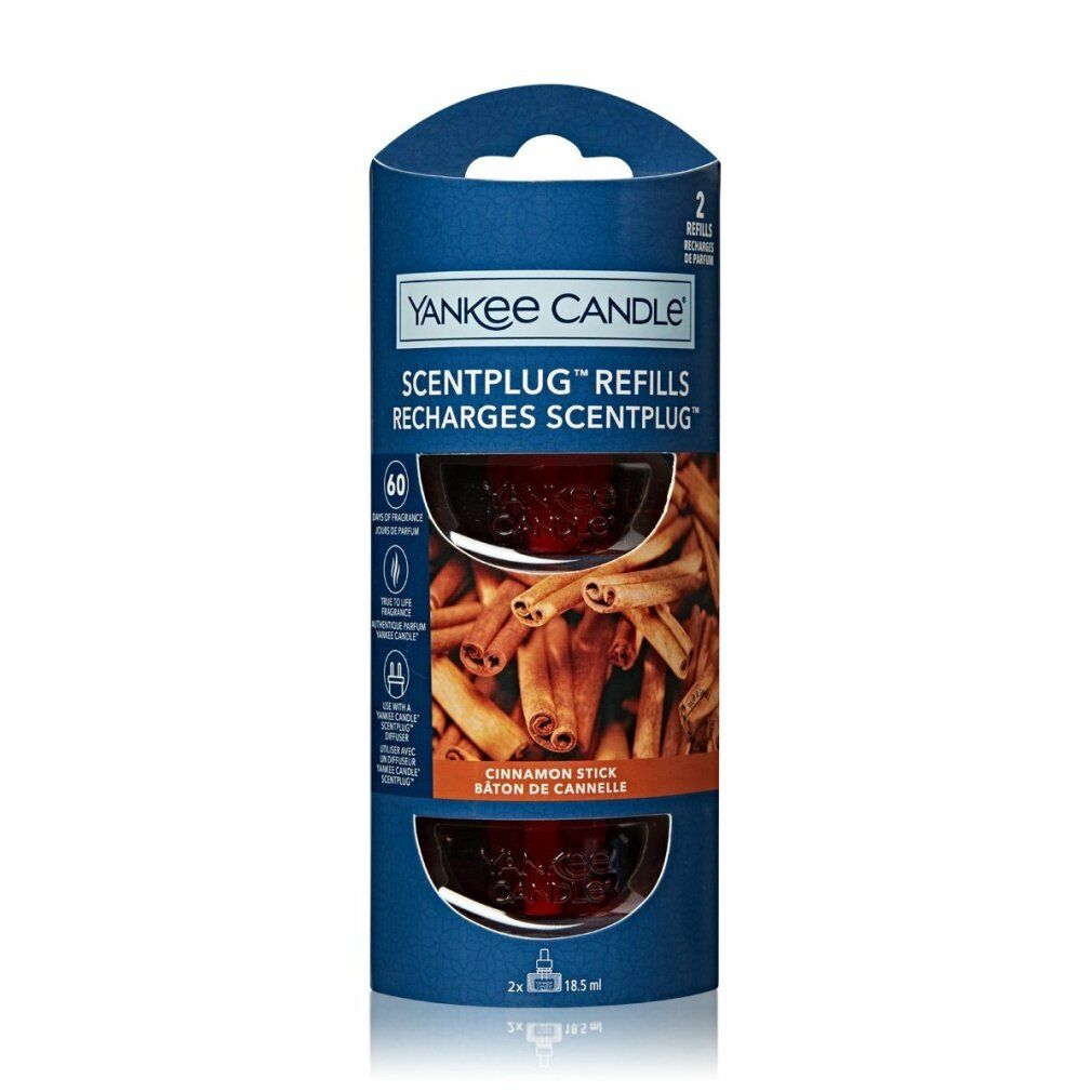 Yankee Candle Scentplug Nachfüllpackung. Zwei Nachfüllungen in zylindrischer Verpackung. Zimt-Sticks-Motiv. Blaue und braune Farben.