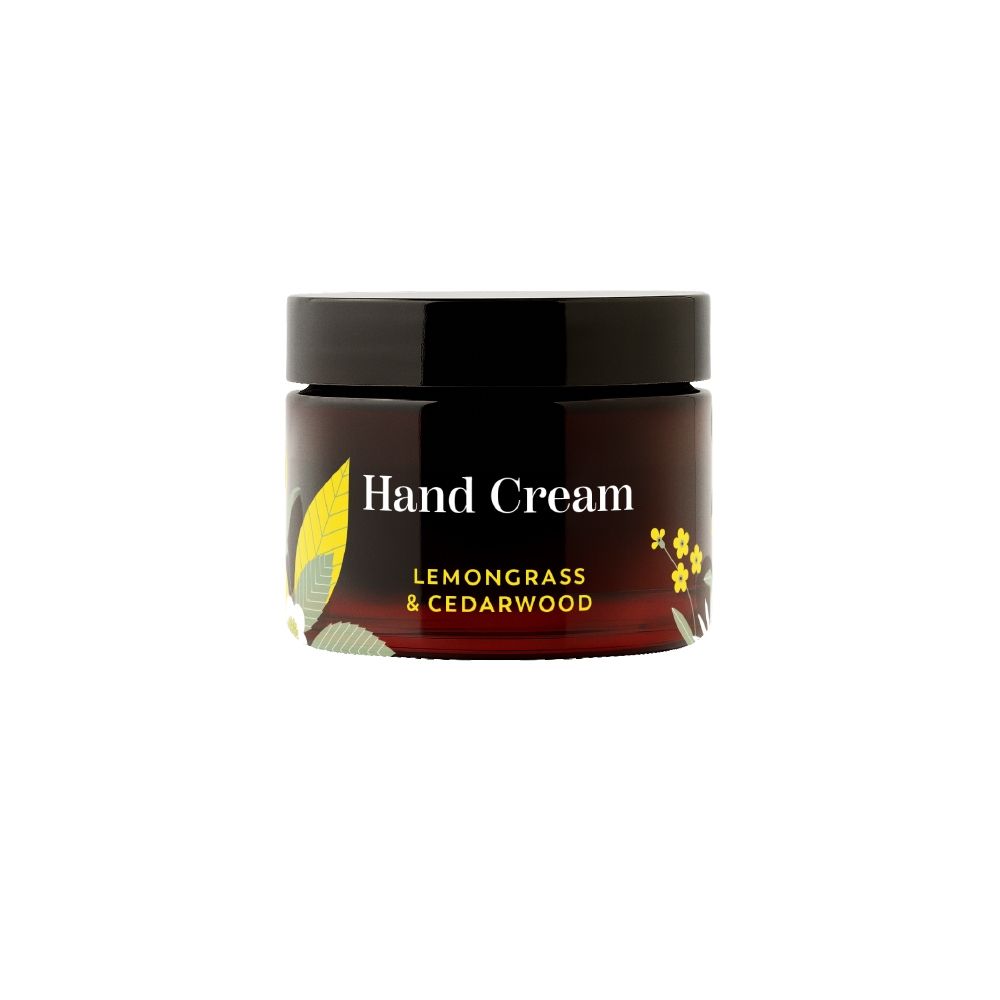 Braune Creme-Dose mit schwarzem Deckel. Aufschrift: Hand Cream, Lemongrass & Cedarwood. Gelbe und grüne Verzierungen.