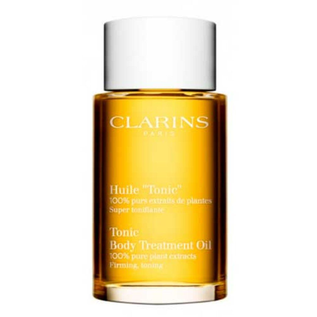 Clarins Huile Tonic Körperöl in einer Glasflasche mit weißem Deckel.