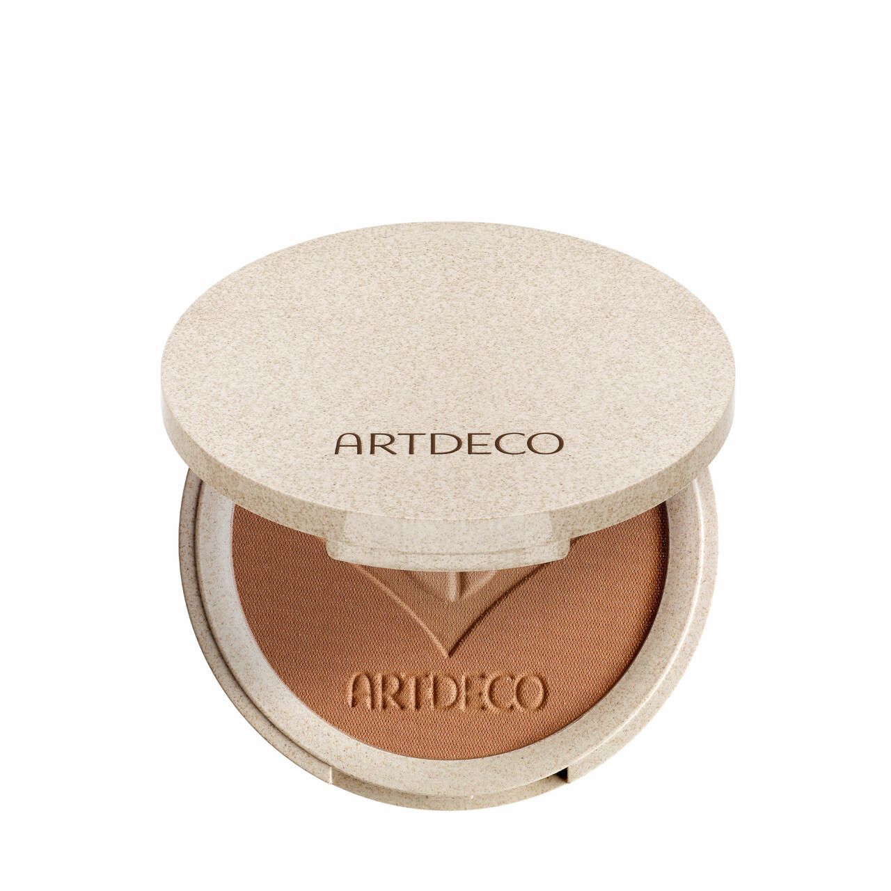 Runder Bronzer-Kompaktpuder, geöffnet. Deckel mit Artdeco-Schriftzug. Bronzer mit floralem Muster.