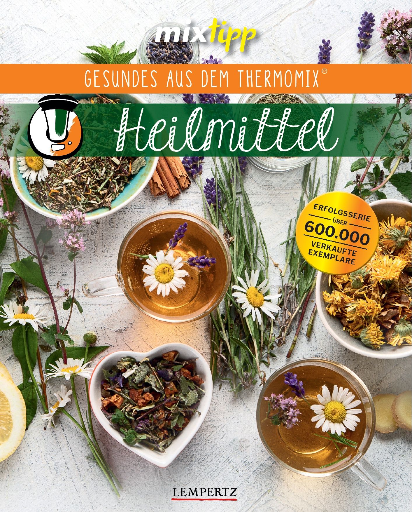 Buch "Heilmittel" mit Kräutern, Tee und Blüten. Aufschrift "Gesundes aus dem Thermomix". Goldene Plakette "Erfolgsserie über 600.000 verkaufte Exemplare".