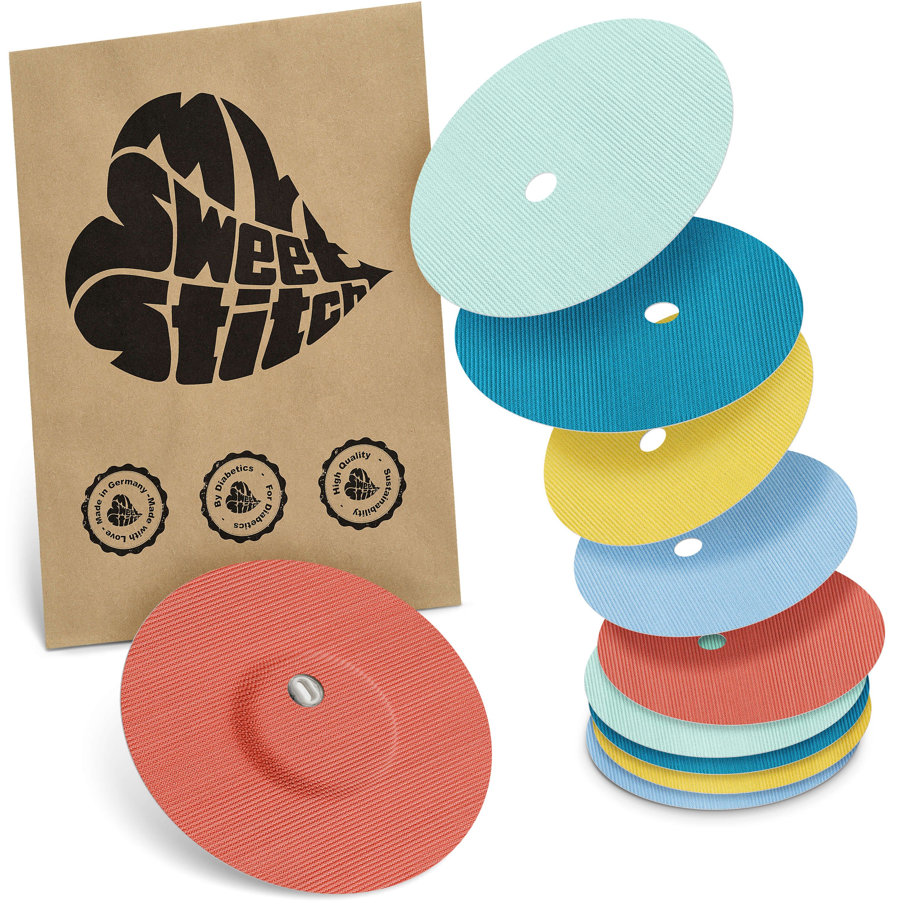 Mehrfarbige runde Pflaster mit Belüftungsloch und brauner Verpackung mit Logo. Stapel von Pflastern in verschiedenen Farben.