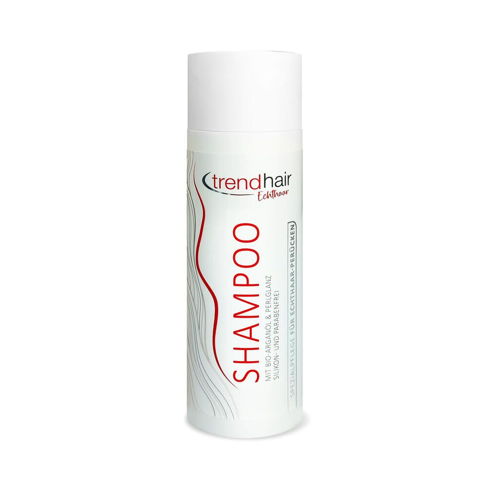 Weiß-silberne Shampoo-Flasche mit roter Schrift. Oben steht "trendhair Echthaar". Darunter "SHAMPOO".