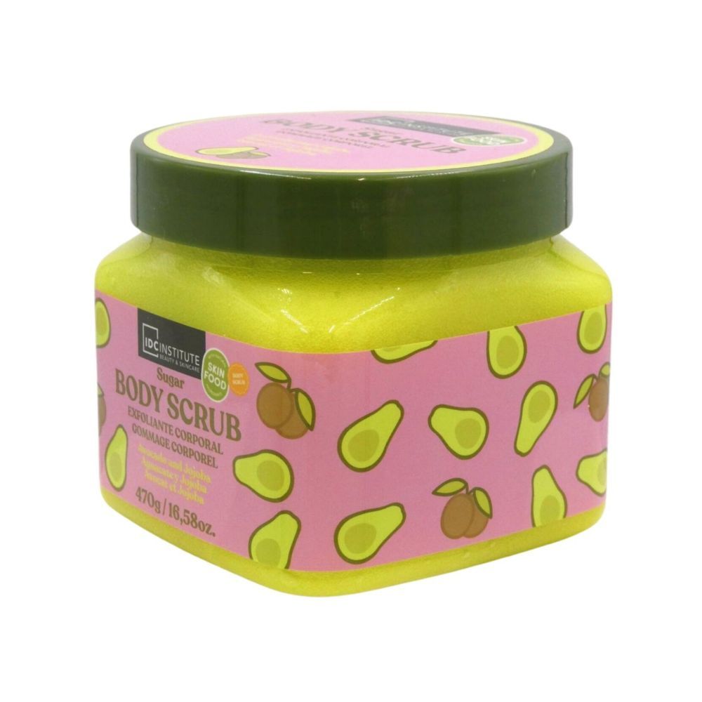 Quadratischer Behälter mit Körperpeeling. Rosa Etikett mit Avocado- und Jojoba-Illustrationen. Text: IDC Institute, Body Scrub, 470g.