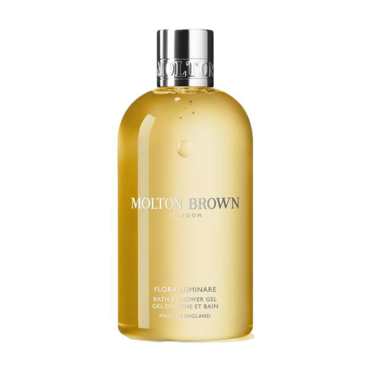 Gelbe Flasche mit silbernem Deckel. Aufschrift: Molton Brown, Flora Luminare Bath & Shower Gel. Hergestellt in England.