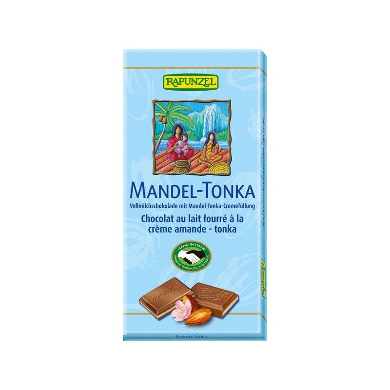 Hellblaue Verpackung mit Schokoladenstückchen, Mandel und Blüte. Text: MANDEL-TONKA, RAPUNZEL. Vollmilchschokolade mit Mandel-Tonka-Cremefüllung.